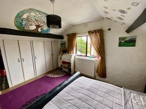 Bedroom One- click for photo gallery